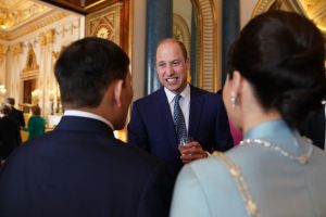 LONDON, ENGLAND - MAY 5: Prince William, Prince of Wales speaks to guests during a reception at Buckingham Palace for overseas guests attending the coronation of King Charles III on May 5, 2023 in London, England. (Photo by Jacob King - WPA Pool / Getty Images)