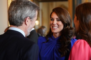 LONDON, ENGLAND - MAY 05: Catherine, Princess of Wales speaks (C) talks with Mary, Crown Princess of Denmark and Crown Prince Frederik of Denmark during a reception at Buckingham Palace for overseas guests attending the coronation of King Charles III on May 5, 2023 in London, England. (Photo by Jacob King - WPA Pool / Getty Images)