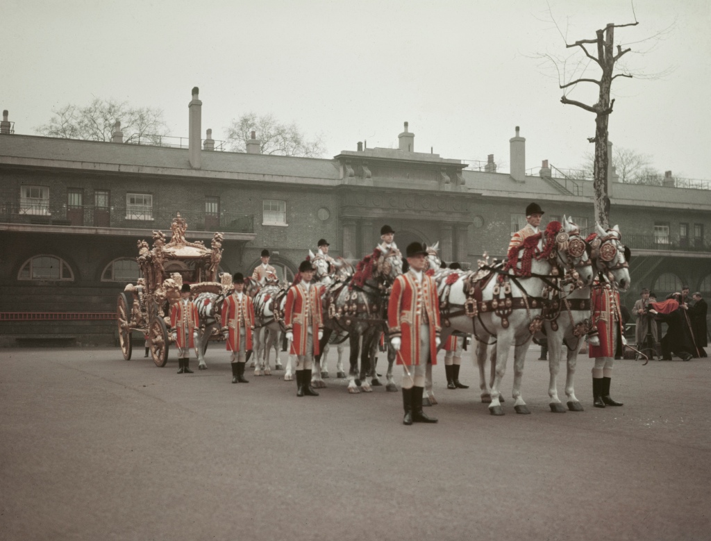 The horse-drawn Royal Coach with grooms and Yeomen of the Guard, preparing for Queen Elizabeth II's coronation, London, circa 1953. (Photo by Hulton Archive/Getty Images)