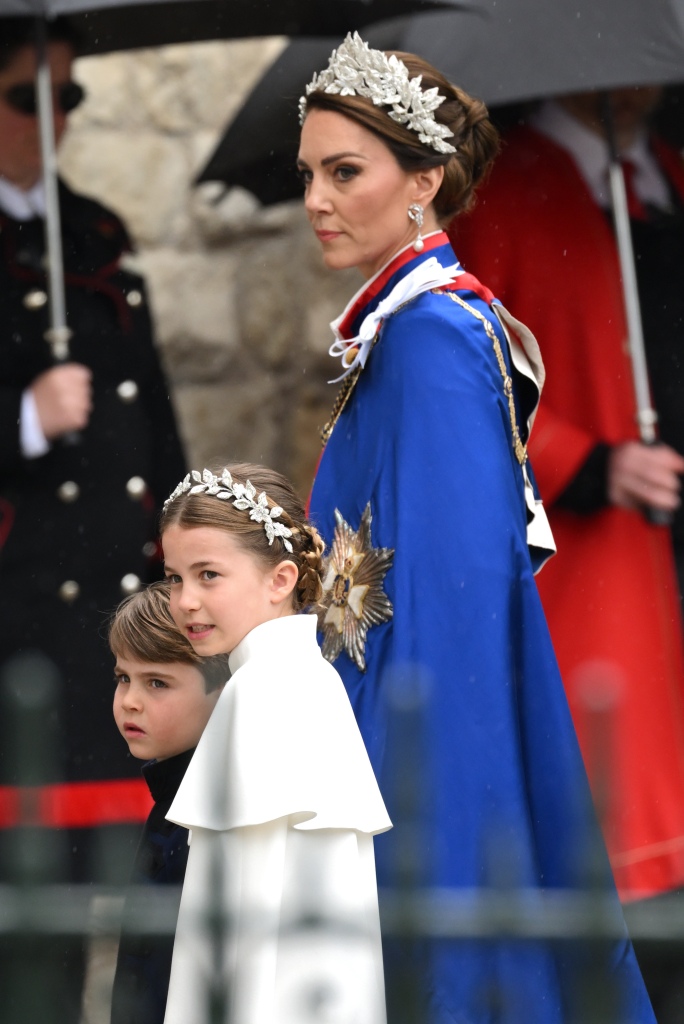 LONDON, ENGLAND - MAY 06: Catherine, Princess of Wales, Prince Louis and Princess Charlotte arrive at Westminster Abbey for the Coronation of King Charles III and Queen Camilla on May 06, 2023 in London, England. The Coronation of Charles III and his wife, Camilla, as King and Queen of the United Kingdom of Great Britain and Northern Ireland, and the other Commonwealth realms takes place at Westminster Abbey today. Charles acceded to the throne on 8 September 2022, upon the death of his mother, Elizabeth II. (Photo by Karwai Tang/WireImage)