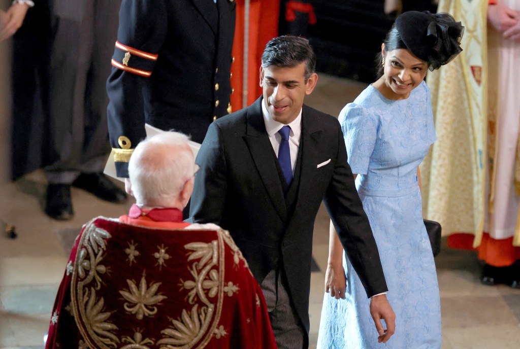 UK prime minister Rishi Sunk and his wife Akshata Murthy attend the Coronation of King Charles III and Queen Camilla at Westminster Abbey on May 6, 2023 in London, England.