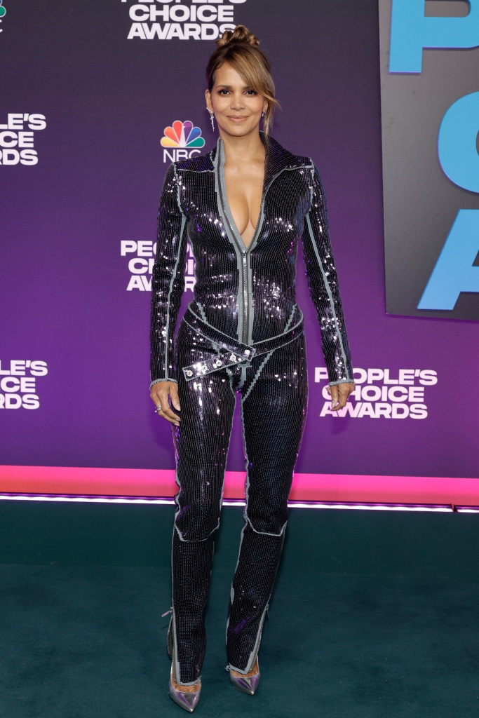 Halle Berry arrives at the People’s Choice Awards wearing a sequin jumpsuit and shiny heels on Tuesday, Dec. 7, 2021, at the Barker Hangar in Santa Monica, Calif.