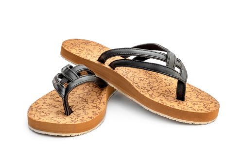 Pair of flip flops with cork soles and black leather straps.