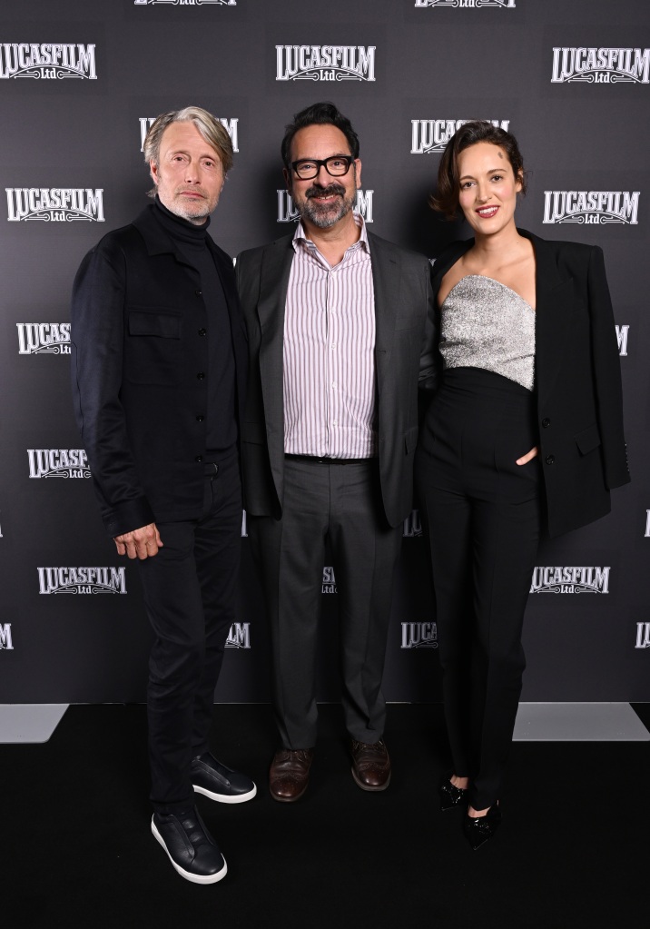 LONDON, ENGLAND - APRIL 07: (L-R) Mads Mikkelsen, James Mangold and Phoebe Waller-Bridge attend the Indiana Jones and the Dial of Destiny presentation during the studio panel at Star Wars Celebration 2023 in London at ExCel on April 07, 2023 in London, England. (Photo by Jeff Spicer/Getty Images for Disney)