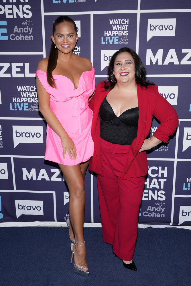 chrissy teigen pink vivienne westwood dress, silver sandals, WATCH WHAT HAPPENS LIVE WITH ANDY COHEN -- Episode 20092 -- Pictured: (l-r) Chrissy Teigen, Robyn Schall -- (Photo by: Charles Sykes/Bravo)