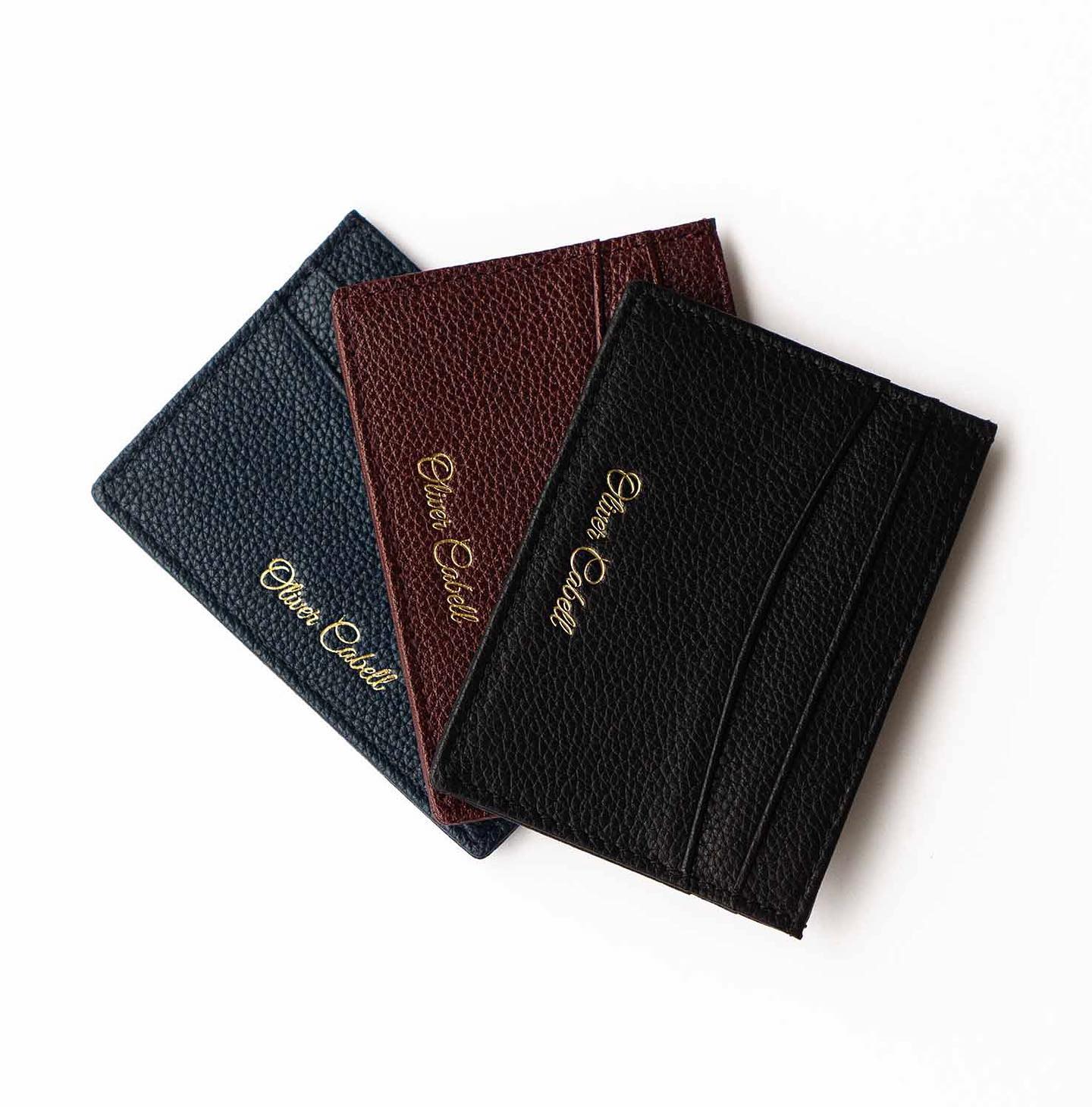 three different colors of leather card holders