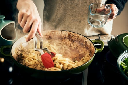 Sliced silverbeet stalks frying in a pan.