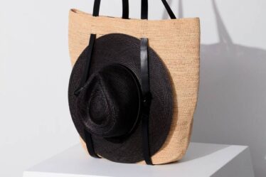 Straw bag that holds a hat.