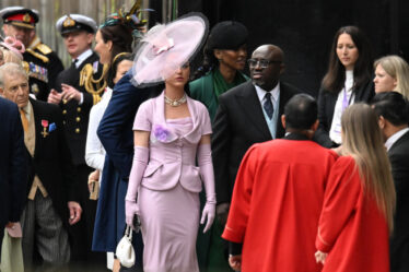 LONDON, ENGLAND - MAY 06: Katy Perry and Edward Enninful arrive at Westminster Abbey ahead of the Coronation of King Charles III and Queen Camilla on May 06, 2023 in London, England. The Coronation of Charles III and his wife, Camilla, as King and Queen of the United Kingdom of Great Britain and Northern Ireland, and the other Commonwealth realms takes place at Westminster Abbey today. Charles acceded to the throne on 8 September 2022, upon the death of his mother, Elizabeth II. (Photo by Jeff Spicer/Getty Images)