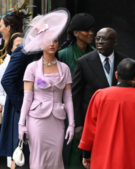 LONDON, ENGLAND - MAY 06: Katy Perry and Edward Enninful arrive at Westminster Abbey ahead of the Coronation of King Charles III and Queen Camilla on May 06, 2023 in London, England. The Coronation of Charles III and his wife, Camilla, as King and Queen of the United Kingdom of Great Britain and Northern Ireland, and the other Commonwealth realms takes place at Westminster Abbey today. Charles acceded to the throne on 8 September 2022, upon the death of his mother, Elizabeth II. (Photo by Jeff Spicer/Getty Images)