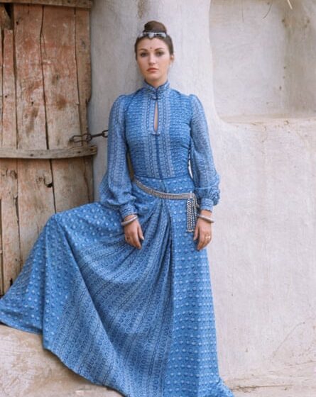 Jane Seymour modelling a blue, full-length Monsoon dress in the 70s.
