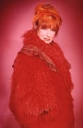 An old photo of Zandra Rhodes in her red coat