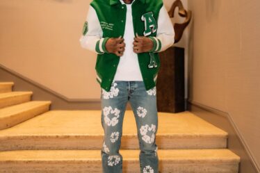 matching a varsity jacket with a pair of Dice Lo sneakers