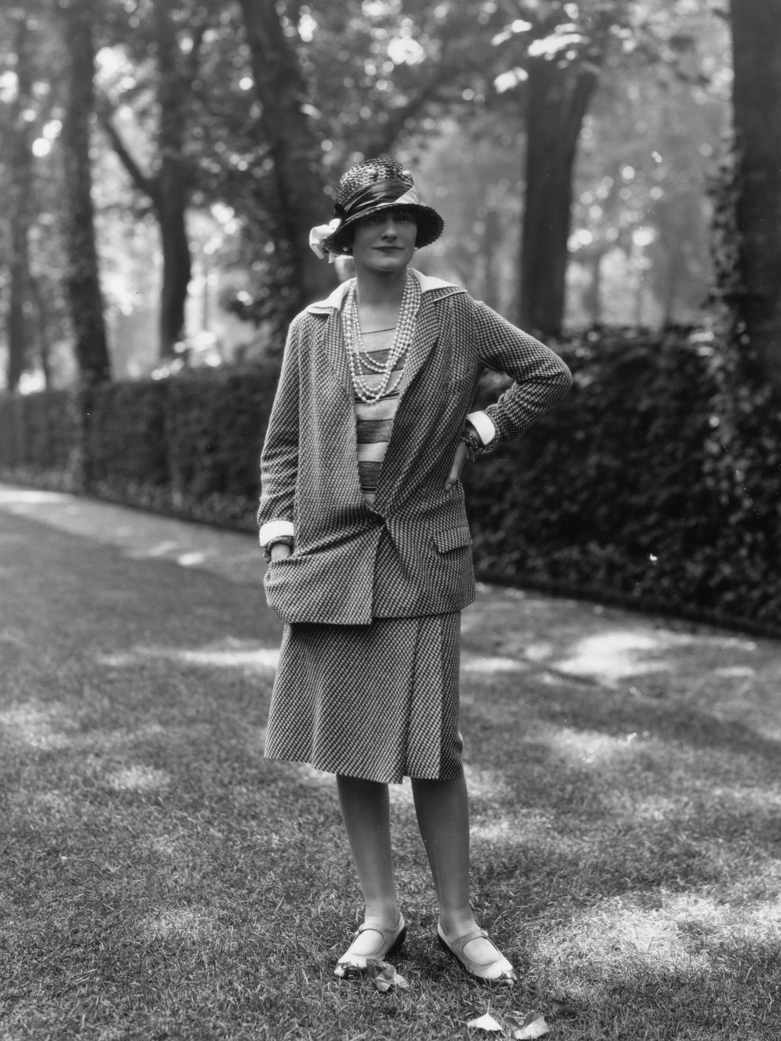 Coco Chanel herself wearing one of the original tweed skirt suits 1929.