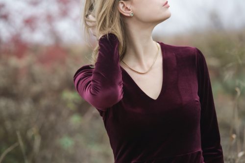 woman in dark purple dress