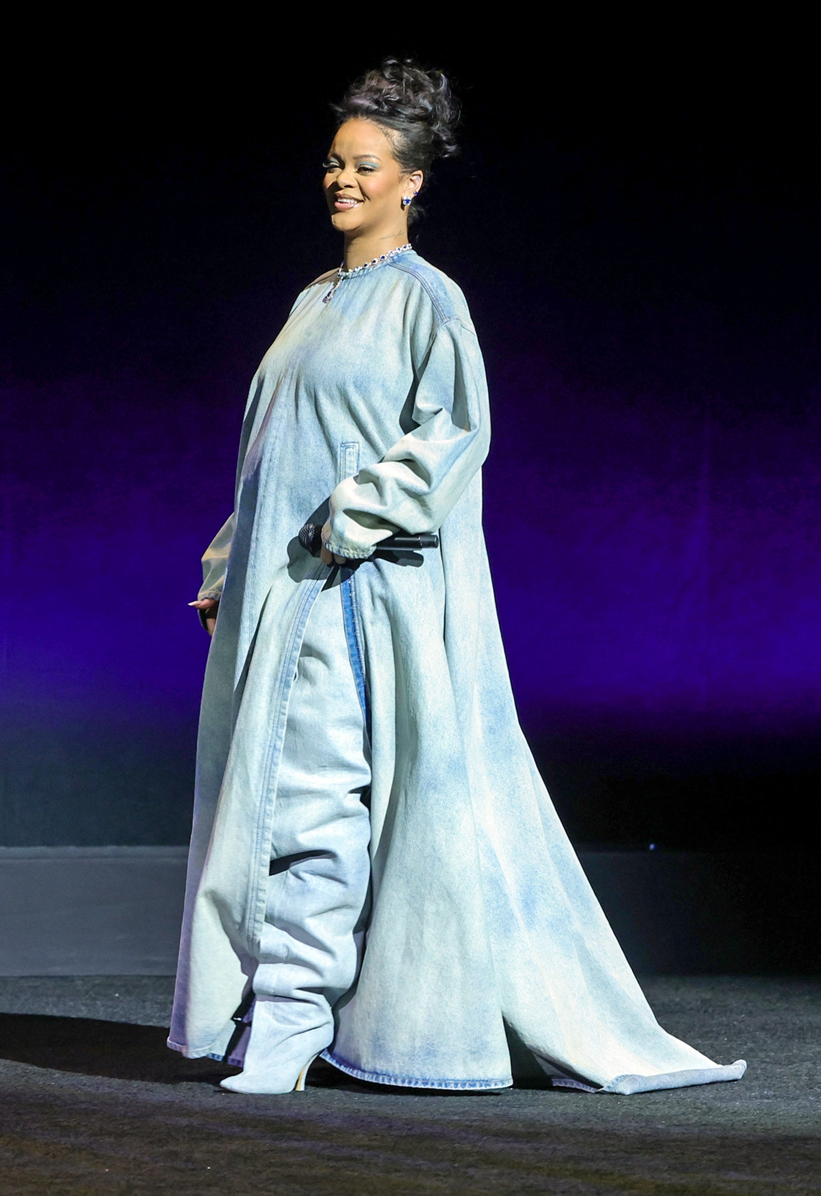 LAS VEGAS NEVADA  APRIL 27 Rihanna walks onstage as she promotes the upcoming film The Smurfs Movie during the Paramount...