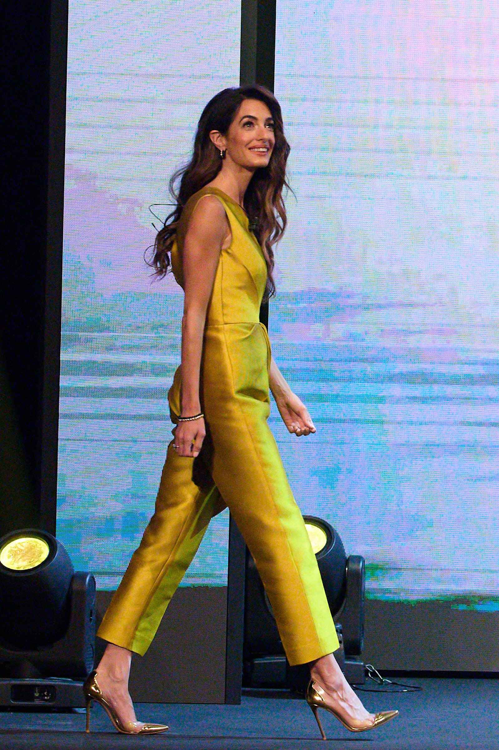 Amal Clooney Trades in a Disco Ball Dress and Curls for a Golden Summer Jumpsuit in Europe