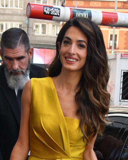 Amal Clooney wears a stunning golden jumpsuit at Madrid conference