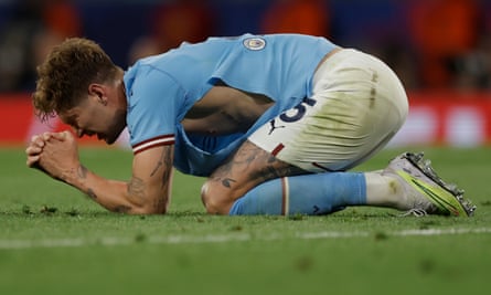 John Stones reveals a bare flank during the Champions League final