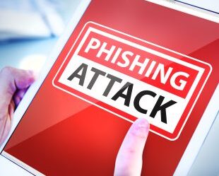 Hands Holding Tablet Phishing Attack