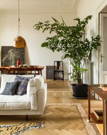 Parquet floors and Ingo Maurer pendant in the open-plan living area