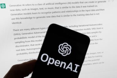 FILE - The OpenAI logo is seen on a mobile phone in front of a computer screen displaying output from ChatGPT, March 21, 2023, in Boston. The head of the artificial intelligence company that makes ChatGPT is set to testify to Congress as lawmakers call for new rules to guide the rapid development of AI technology. OpenAI CEO Sam Altman is scheduled to speak at a Senate hearing Tuesday, May 16. (AP Photo/Michael Dwyer, File)