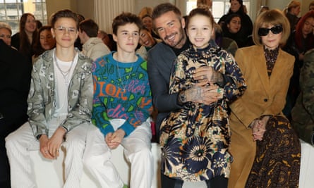 Harper Beckham, second from right, with dad David and Vogue’s Anna Wintour at a fashion show in 2020.