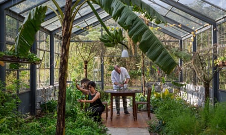 Joao and Marasy at work in the greenhouse.