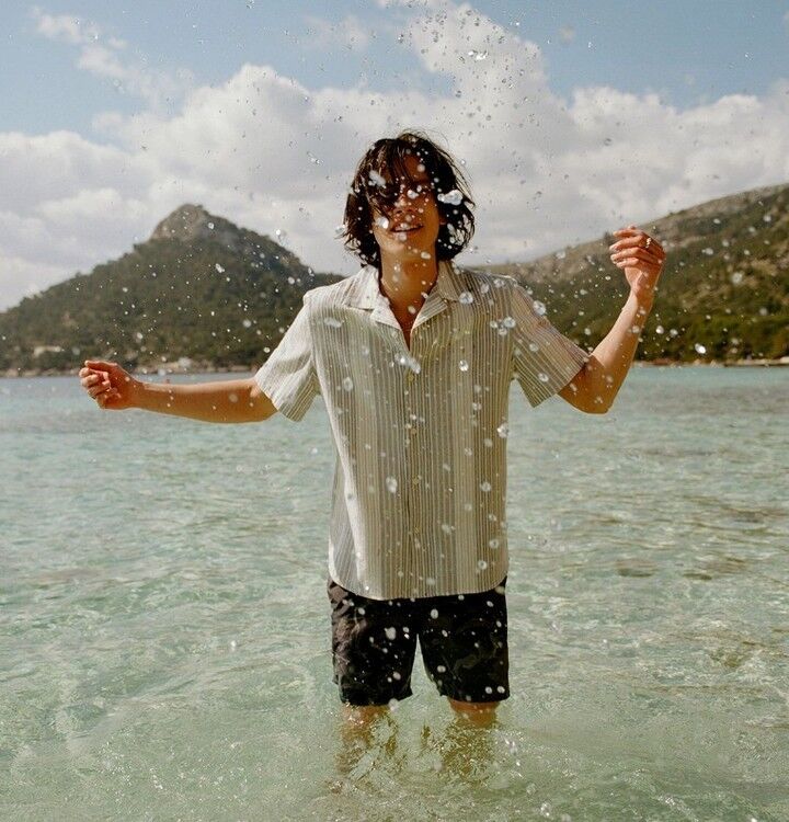 man splashing sea water