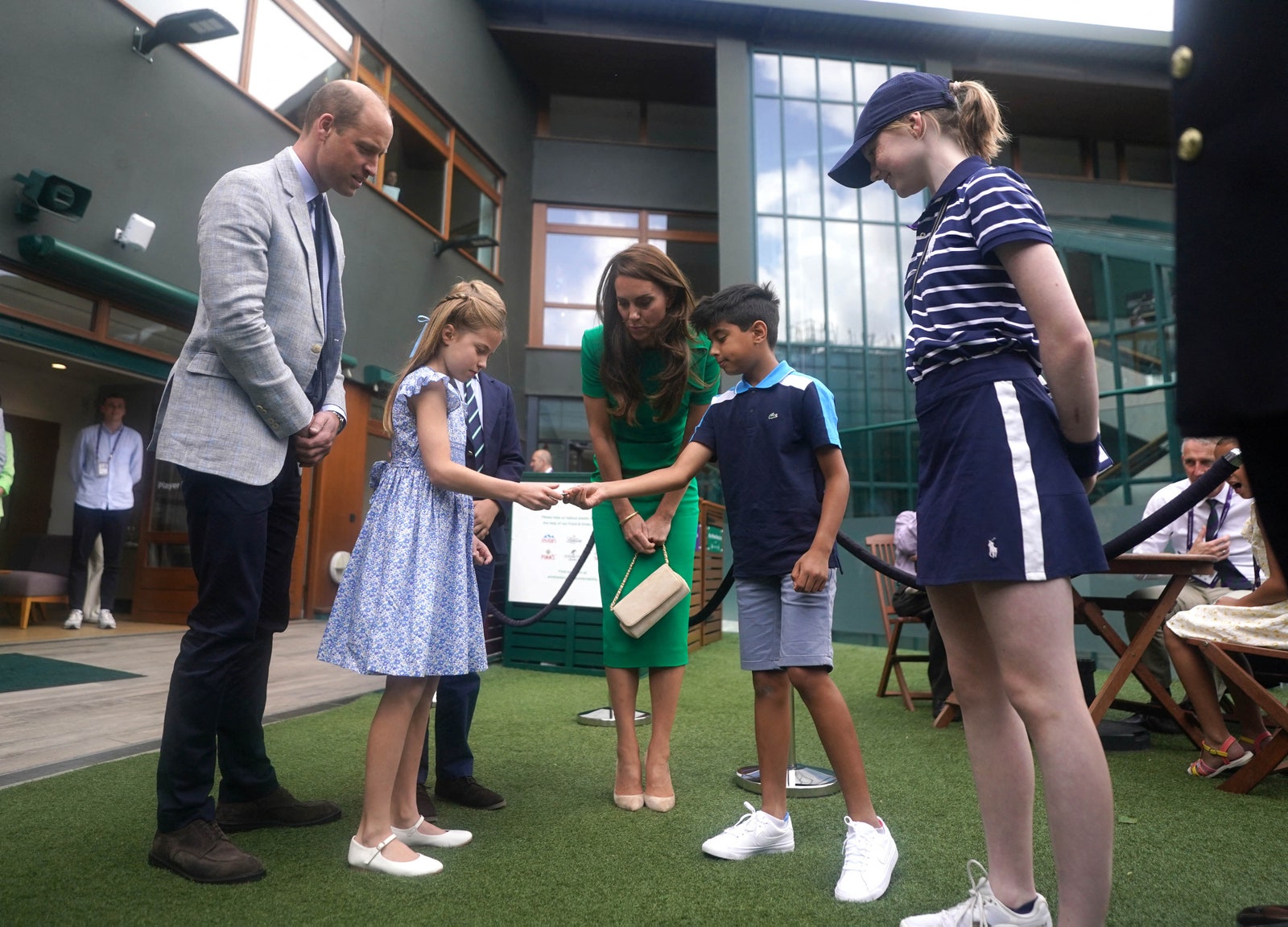 The family meet Mu'awwiz Anwar who performed the men's singles final coin toss at Wimbledon