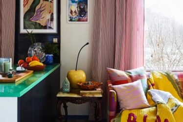 the multi-coloured living room and black kitchen.