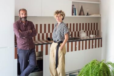 Architects Valentina Giampiccolo and Giuseppe Minaldi, who masterminded the restoration, in the kitchen.