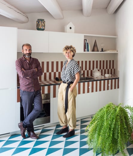 Architects Valentina Giampiccolo and Giuseppe Minaldi, who masterminded the restoration, in the kitchen.