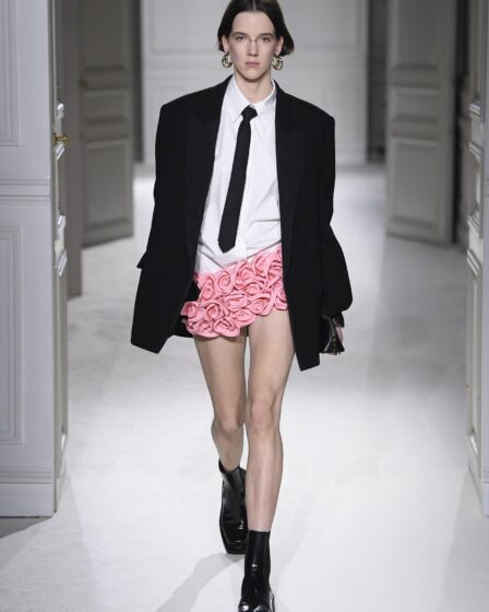 A model wears the Valentino miniskirt on the runway.