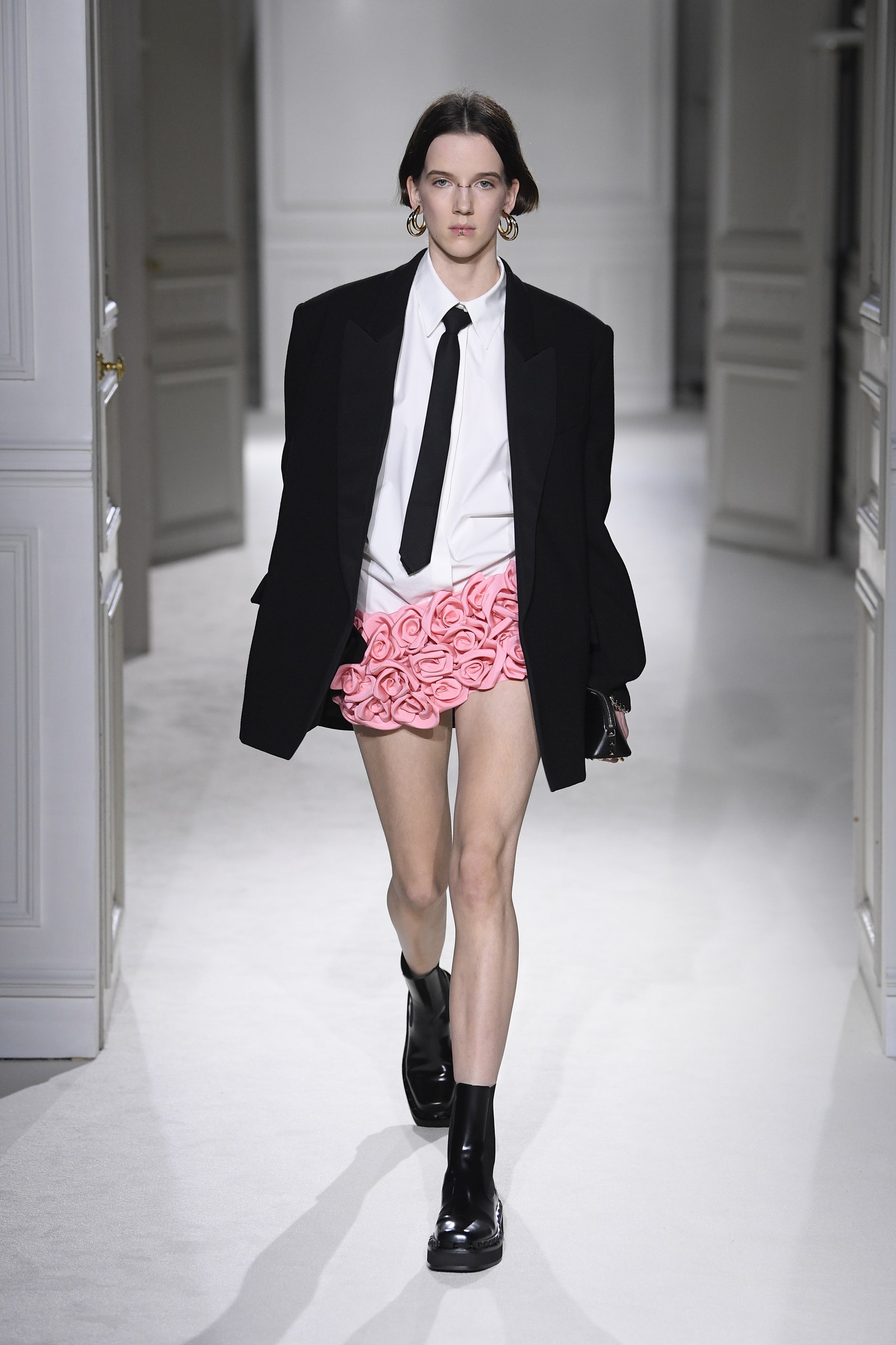 A model wears the Valentino miniskirt on the runway.