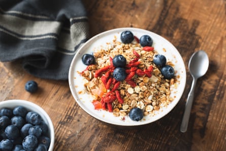 A bowl of granola with goji berries, blueberries and apricot