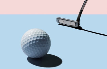 Head of a golf club behind a golf ball