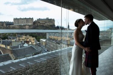 A wedding at the Hilton Double Trees Hotel in Edinburgh with Edinburgh Castle in the background.