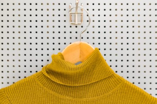 yellow turtleneck on hanger