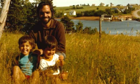 Charlotte Gill as a child with her dad and brother by a river