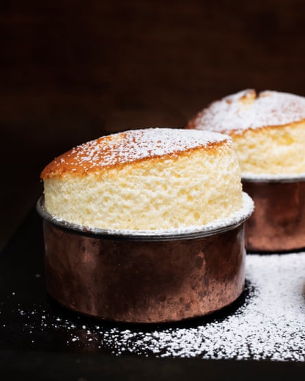 ‘A vanilla-scented pudding that rises, soufflé-style, as it bakes’: cream cheese puddings with summer berry sauce.