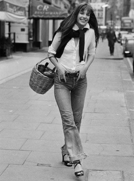 Jane Birkin strolls down a street in London in 1973 holding a wicker basket