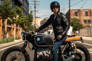 man riding a classic bmw motorcycle