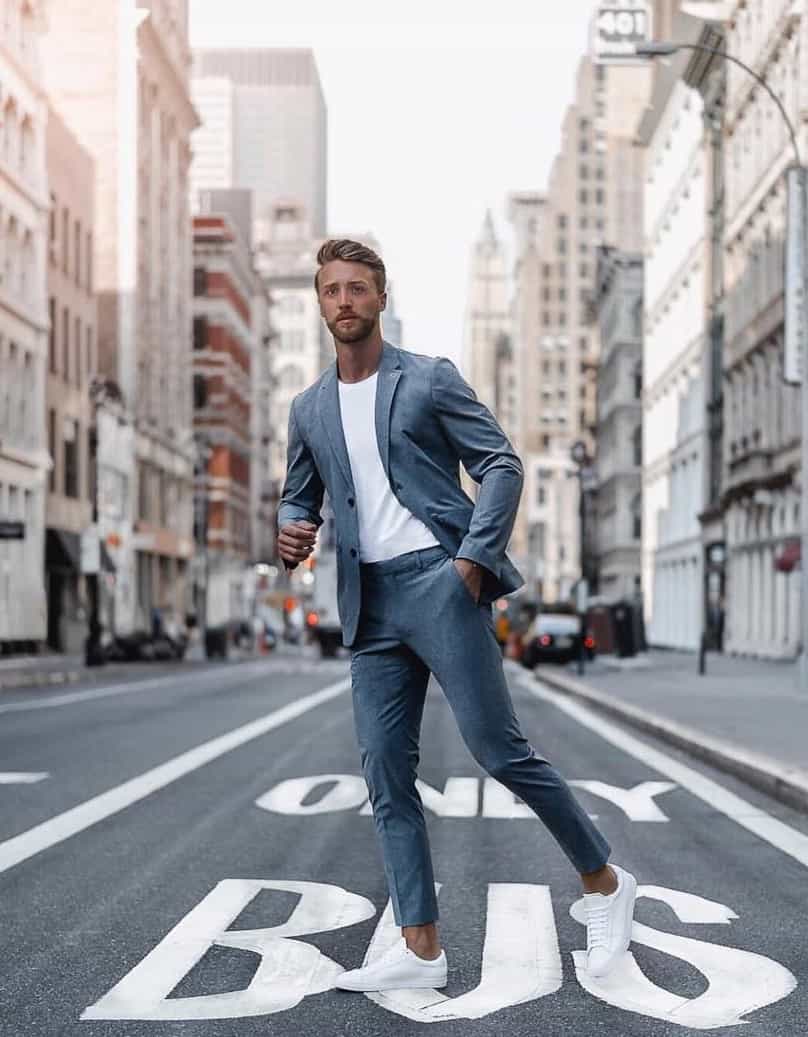 man in a suit crossing the street