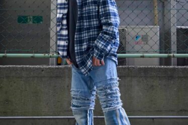 man wearing a baggy flare jeans