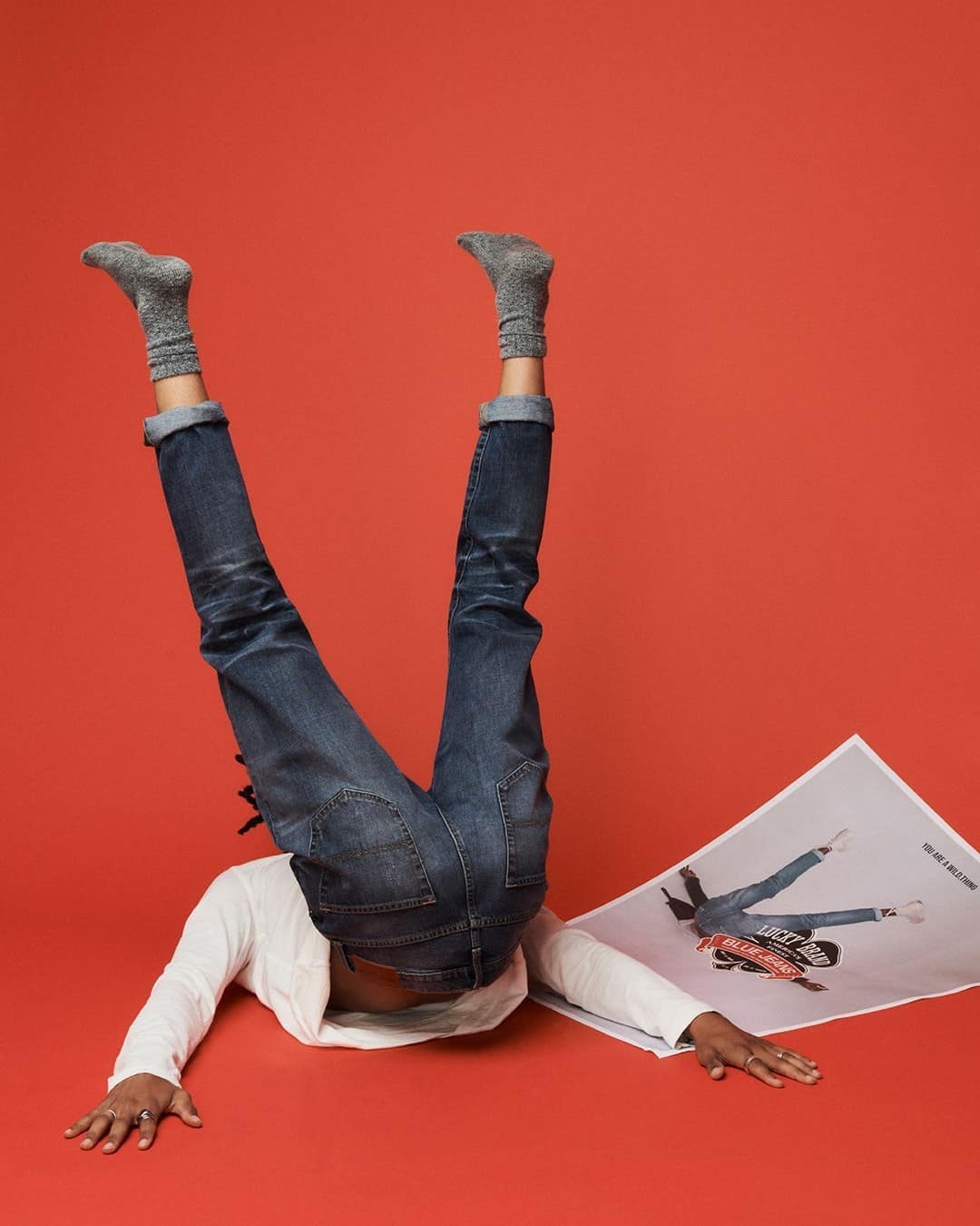 man showing the back side of jeans upside down