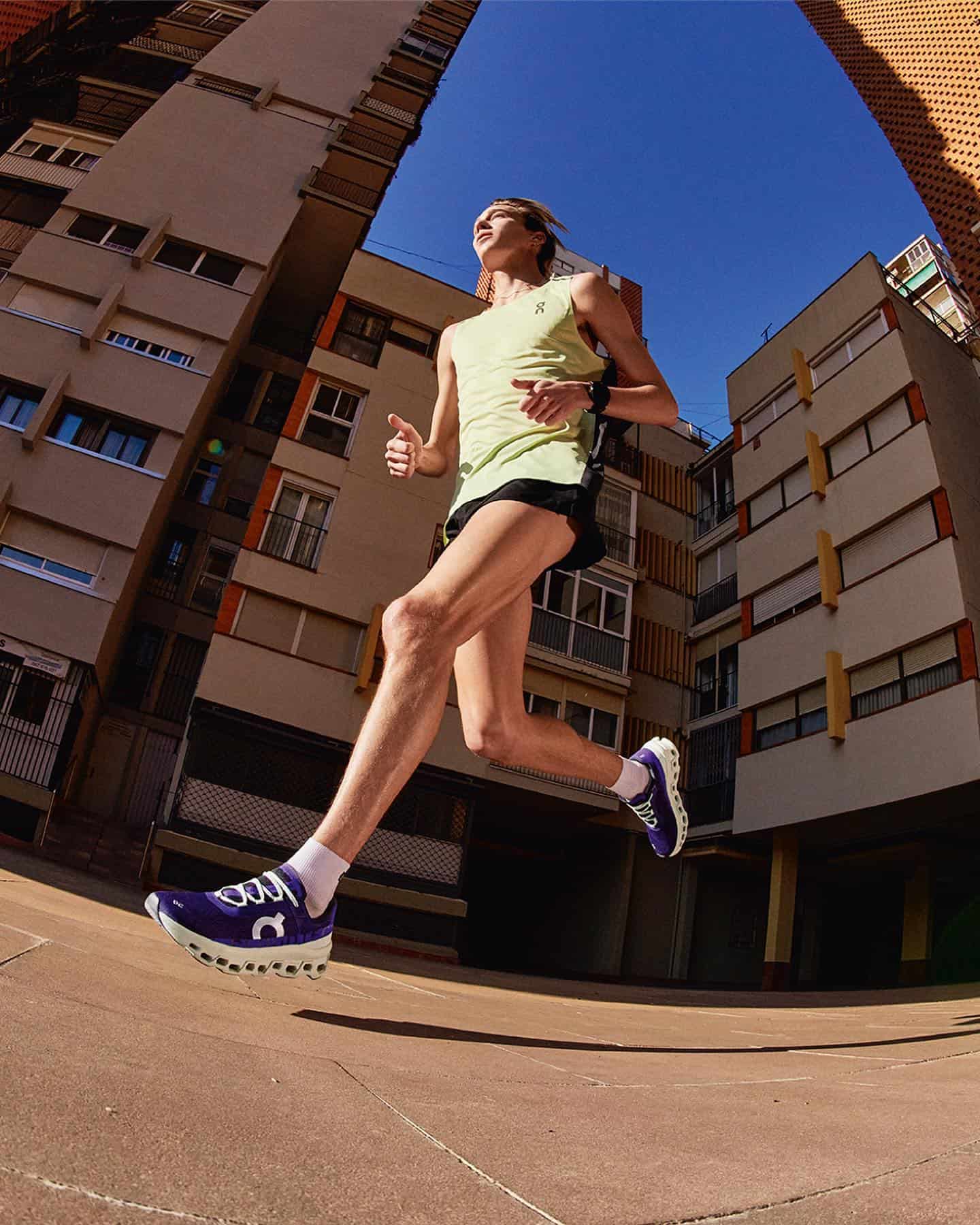 man wearing a pair of purple running shoes