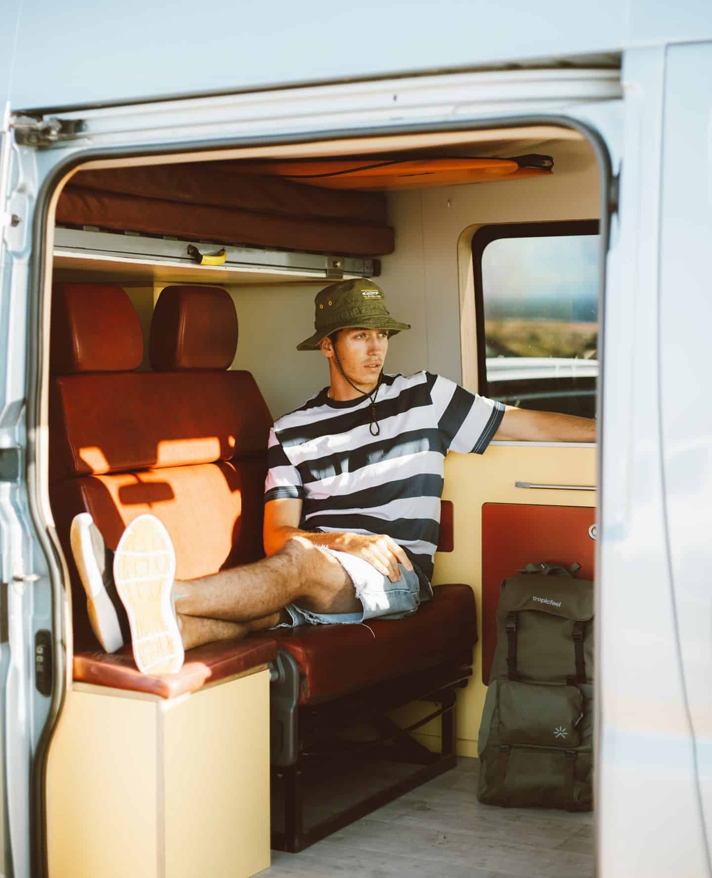 man resting inside a van