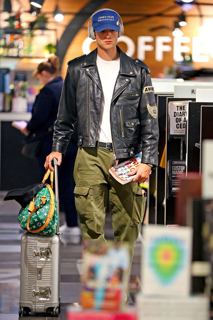 Sydney, AUSTRALIA  - *EXCLUSIVE*  - Actor Jacob Elordi wears a ‘James Dean Death Cult’ Cap and Leather jacket as he browses the book store at Sydney Airport. Pictured: Jacob Elordi 28 OCTOBER 2023  BYLINE MUST READ: KHAPBM / BACKGRID USA: +1 310 798 9111 / usasales@backgrid.com UK: +44 208 344 2007 / uksales@backgrid.com *UK Clients - Pictures Containing Children Please Pixelate Face Prior To Publication*