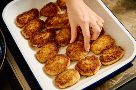 Golden fried rissoles on a baking tray